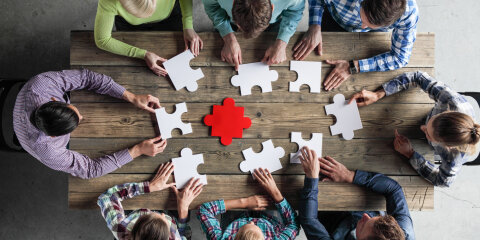 Business people and puzzle