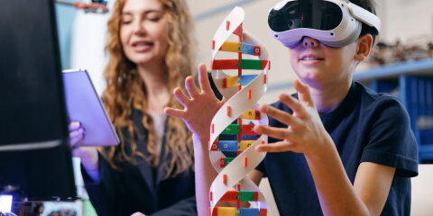 Student using vr headset exploring dna model with teacher in classroom, AI intelligence technology for children in school