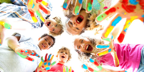 smiling kids with colourfull hands